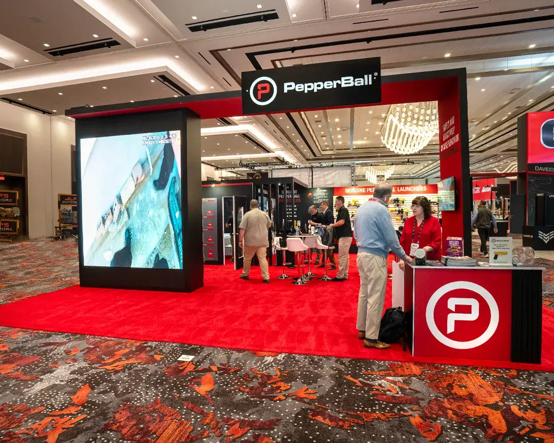 30×30 Trade Show Booth Rental for PepperBall At Shot Show, Designed and Built By Exponents in Las Vegas