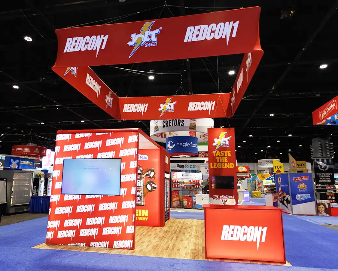 20x20 Exhibit Booth Rental for Redcon at NACS 2025, Designed and Built By Exponents in Chicago, IL 20x20 Exhibit Booth Rental for Redcon at NACS 2025, Designed and Built By Exponents in Chicago, IL
