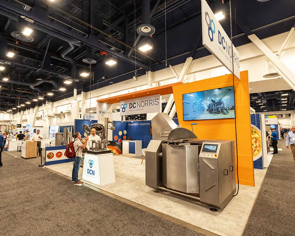 20x30 Trade Show Booth for DCN at Pack Expo, Designed and Built By Exponents in Las Vegas 20x30 Trade Show Booth for DCN at Pack Expo, Designed and Built By Exponents in Las Vegas