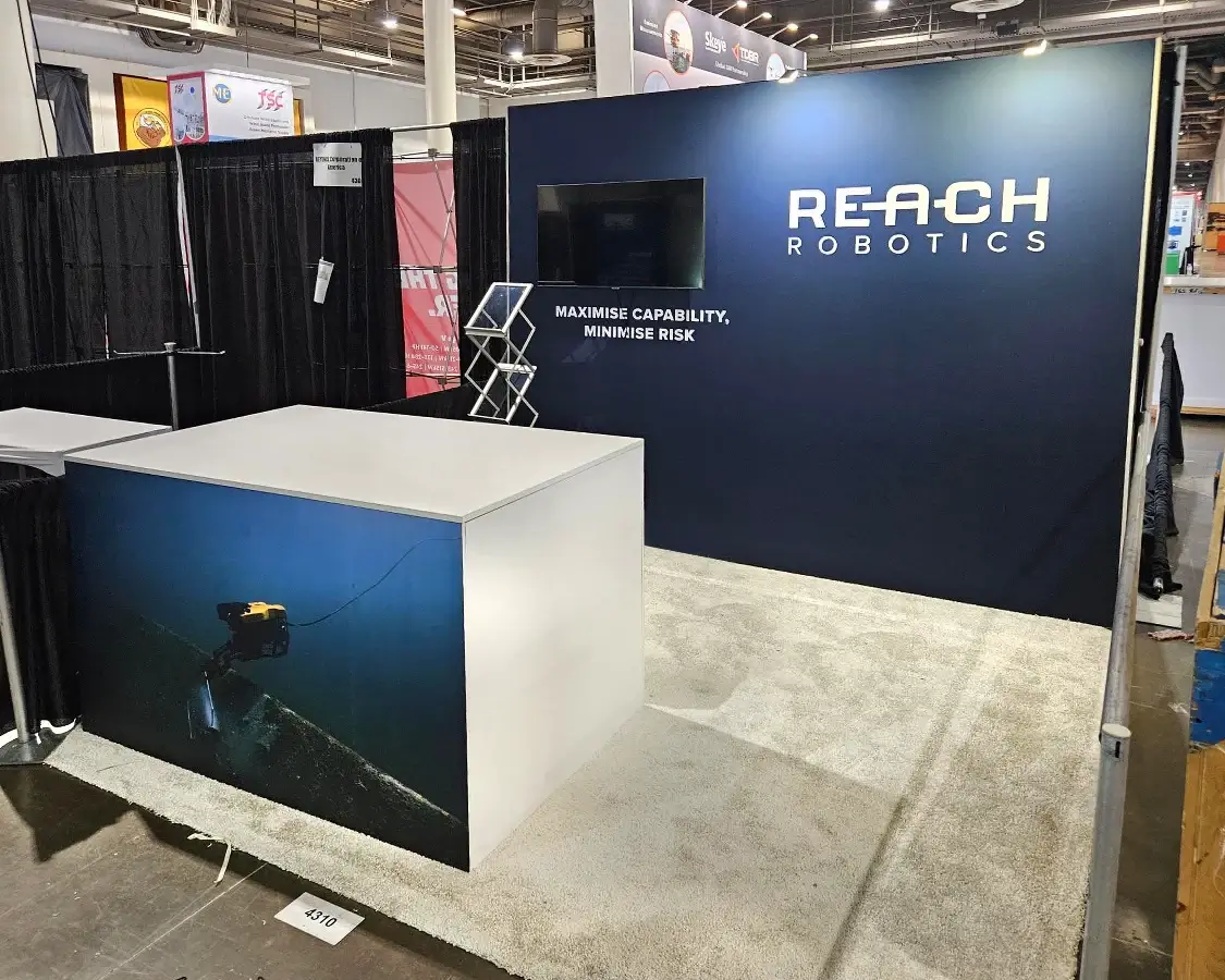 10x10 Exhibition Stand for Reach Robotics at OTC, Designed and Built by Exponents in Houston, TX