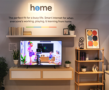 Google Fiber home demo setup with custom TV display and shelving